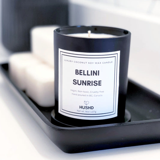 Luxury Bellini Sunrise candle made with vegan coconut soy wax and notes of sparkling prosecco and juicy peach. Handmade in Canada. 